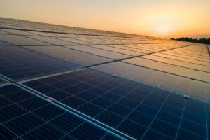 Blue photovoltaic solar panels mounted on building roof